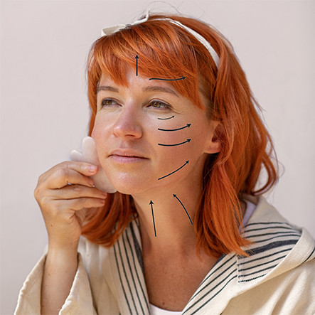 Arcmasszírozás gua sha kővel